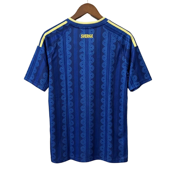 Blue sports jersey with yellow accents on a hanger against a light gray background