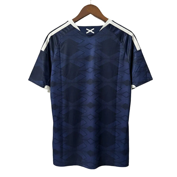 Blue sports jersey with white accents on a hanger against a gray background