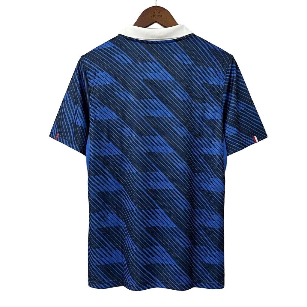 Blue patterned shirt on a hanger against a gray background