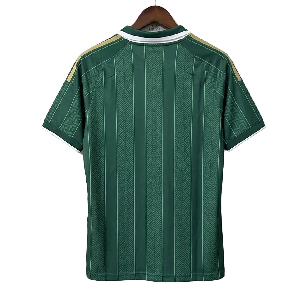 Green sports jersey with white and gold accents on a hanger against a gray background
