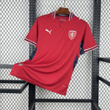 Red sports jersey with a logo on a hanger against a wire mesh background