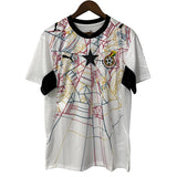 White sports jersey with black and red designs on a gray background