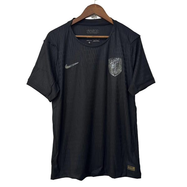 Black sports jersey with Nike logo on a hanger against a white background