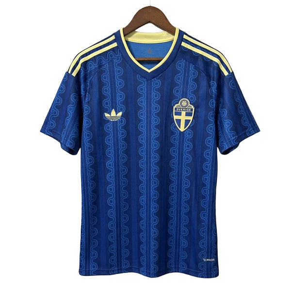 Blue sports jersey with yellow accents on a hanger against a gray background