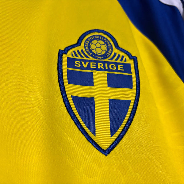 Sweden national team logo on a yellow sports jersey